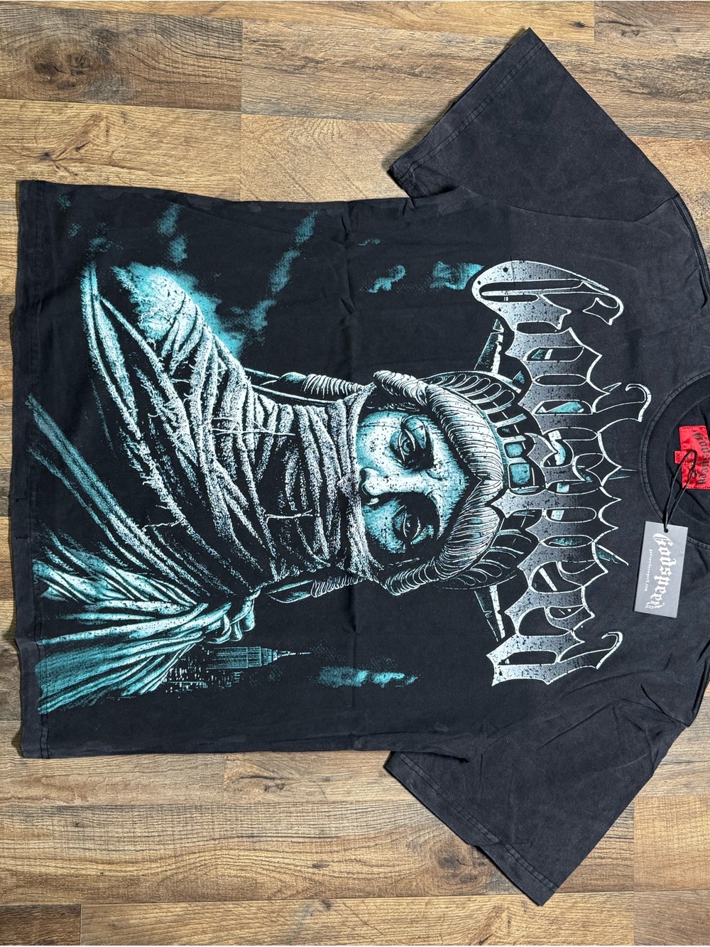Godspeed T-shirts Needle & Thread Black Tee with Teal Statue Graphic